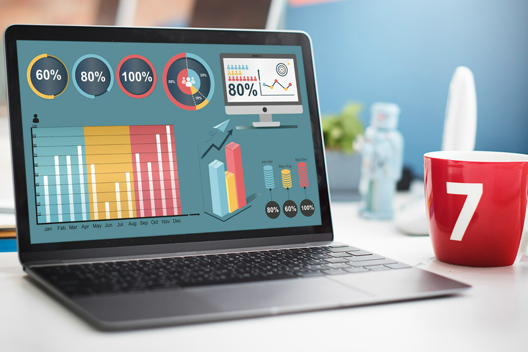 A laptop with SEO graphs on the screen.